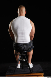 Whole Body Man White Sports Shorts Muscular Sitting Top Studio photo references